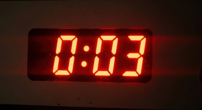 Red digital timer display showing three seconds remaining in countdown