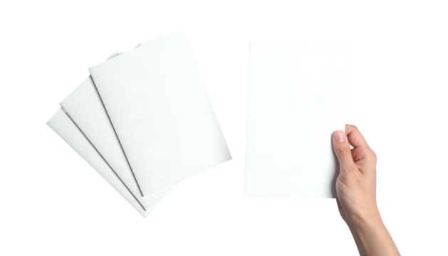 Hand holding a single blank paper next to a stack of folded, blank sheets