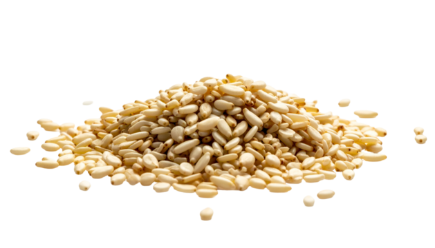 Pile of small, tan, oval-shaped seeds against a black background