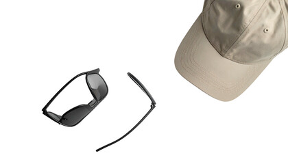 Cap and eyeglasses float against a stark, isolating black background