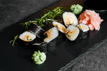 Sushi arrangement with soy sauce bowl and chopsticks