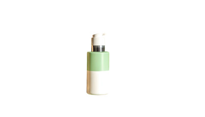 Isolated pump bottle with white and green sections, silver cap against a black background
