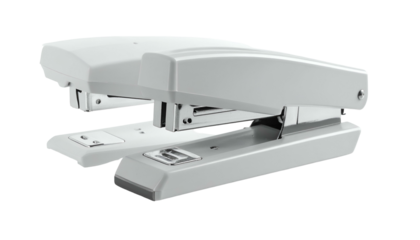 Two pale staplers overlap, ready to fasten sheets of paper