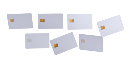 Seven blank, rectangular cards with embedded chips, slightly angled against a black background