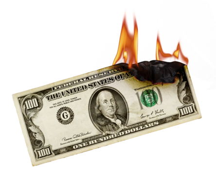 Burning money. US dollar banknote burning. Burning Money a visual metaphor of financial loss and waste