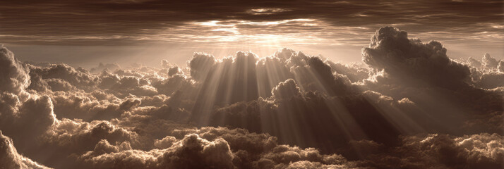 Sun rays breaking through dramatic storm clouds