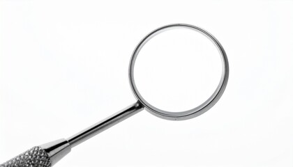 A close-up of a circular dental mirror with a metal handle and textured grip placed against a plain white background