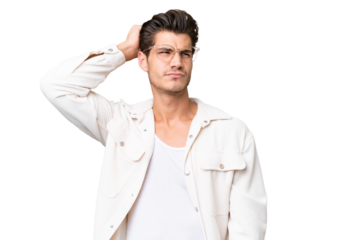 Young handsome caucasian man over isolated background having doubts while scratching head