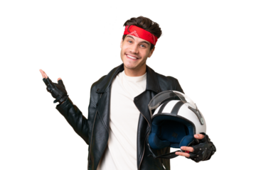 Young caucasian man with a motorcycle helmet over isolated background extending hands to the side for inviting to come