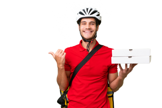 Pizza delivery man with work uniform picking up pizza boxes over isolated background pointing to the side to present a product