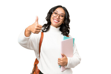 Young Argentinian student woman over isolated background with thumbs up because something good has...