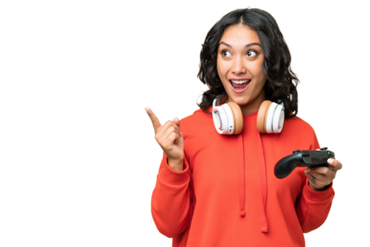 Young Argentinian woman playing with a video game controller over isolated background intending to realizes the solution while lifting a finger up