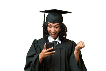Young university graduate Argentinian woman over isolated background surprised and sending a message