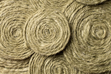 A solid background of colorful threads for cross stitch and needlework. Textured background for needlework and design. Rainbow of threads. Rows of colorful embroidery threads.