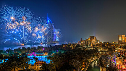 Spectacular night view of Dubai city with dazzling fireworks surrounding the Burj Khalifa, the tallest building in the world. The city lights, skyscrapers, and vibrant reflections capture the exciteme © wahyudi