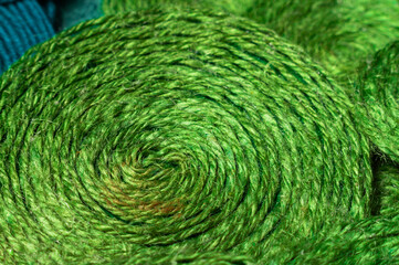 A solid background of colorful threads for cross stitch and needlework. Textured background for needlework and design. Rainbow of threads. Rows of colorful embroidery threads.