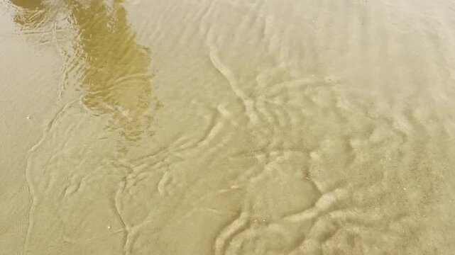 Good bye 2025 written in beach sand texture background