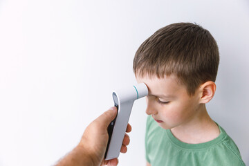 Infrared Thermometer Measuring Childs Temperature Medical Check Concept