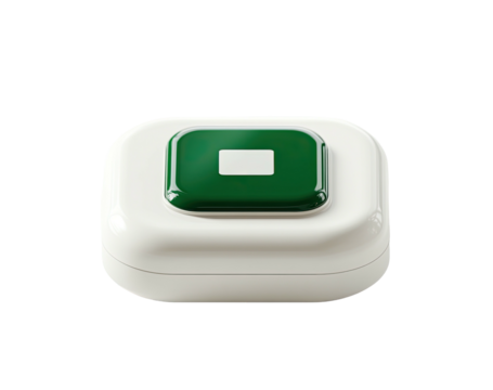Creamy box with green button centered, lit from above