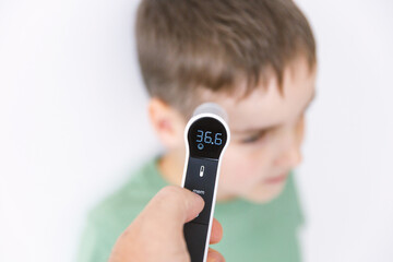Infrared Thermometer Measuring Childs Temperature Medical Check Concept