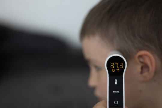 Infrared Thermometer Measuring Childs Temperature Medical Check Concept