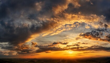 Obraz premium Dramatic Sunset Sky with Cirrus Clouds and Vibrant Colors 