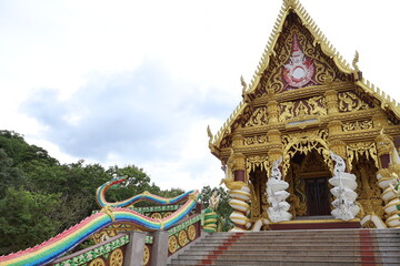 Naklejka premium Two Thai temples in the same frame, one more elaborate than the other