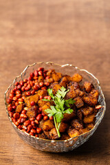 Kelewele, Fried Ripe Plantain Seasoned with Ginger, Cloves, and Pepper, Served with Roasted Groundnuts, a Popular Spicy Ghanaian Snack