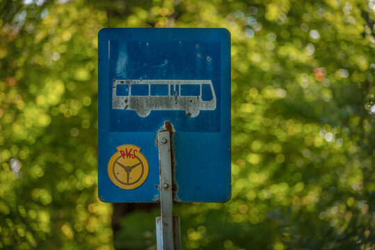 BUS STOP IN THE VILLAGE - An old roadside sign on a local country road