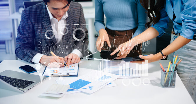 Team colleagues wear formal attire to work together to optimize business processes by using new technologies. high tech hologram - Powered by Adobe