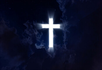 Christian cross appears bright in the night sky background