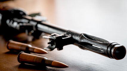 Kalashnikov assault rifle on a wooden background