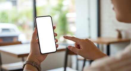 Person using smartphone in cafe setting