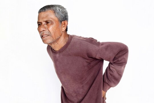 A 66-year-old man experiencing back pain, isolated on a white background.