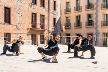 Street dancers performing contemporary choreography in urban setting
