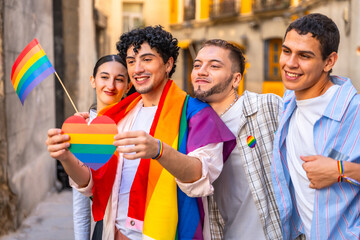 Group of friends celebrating lgbt pride with rainbow symbols