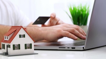 A man makes online purchases on the Internet - Powered by Adobe