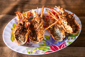 Fried lobster head at a restaurant in El Cuyo, a fishing village in the Yucatan region of Mexico.