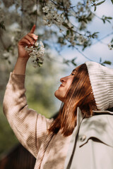 A girl smells flowers 7298.