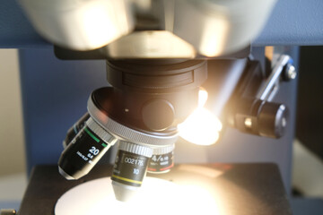 Close-up of a modern microscope lens in a laboratory