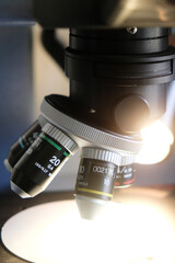 Close-up of a modern microscope lens in a laboratory