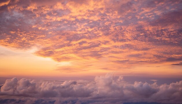 Soft altocumulus clouds glowing in the warm morning sky at sunrise
 - Powered by Adobe