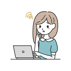 パソコンの前で悩む女性