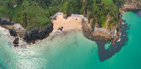 Panoramic aerial view of Arama Beach on sunny summer day. Pechon, Spain.