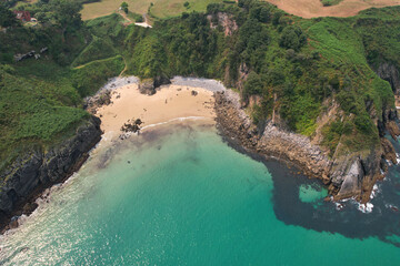 Drone view of Arama Beach on sunny summer day. Pechon, Spain.
