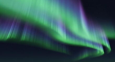 A vibrant display of the Northern Lights, showcasing the natural phenomenon in a mesmerizing green and purple hue against a dark sky.