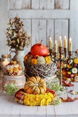 Beautiful autumn decoration with pumpkins and hay wreaths.