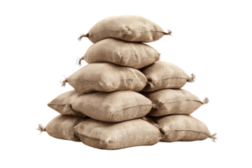 A stack of beige burlap sacks.  They are tightly packed, forming a pyramid shape.  The sacks have knotted tops.  Isolated on black background
