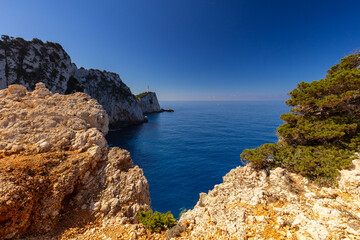 Lefkada's Dramatic Cliffs Overlooking the Ionian Sea with Distant Lighthouse, wallpaper or background