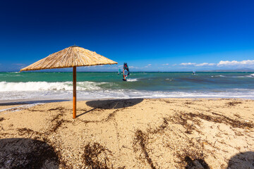 Windsurfers Enjoying the Waves on a Sunny Beach, Greek island of Lefkada